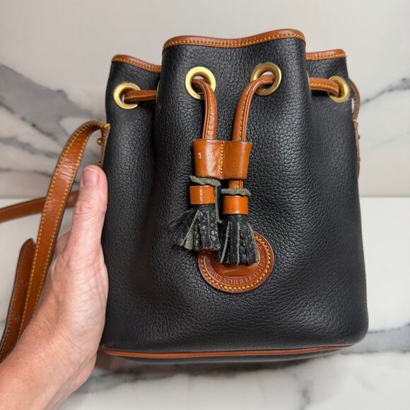 Dooney & Bourke Handbags - Vintage Dooney & Bourke All-Weather Black Leather Drawstring Bucket Bag Small